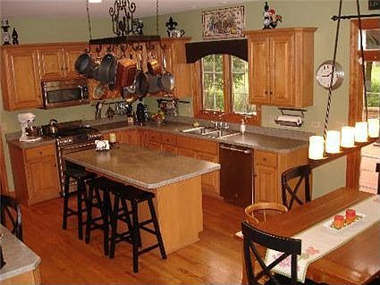 View of kitchen from split stairs