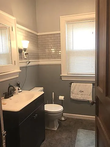 Bath has claw foot tub and shower