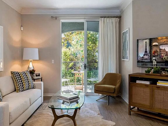 Living Room with Access to Private Balcony and Natural Light