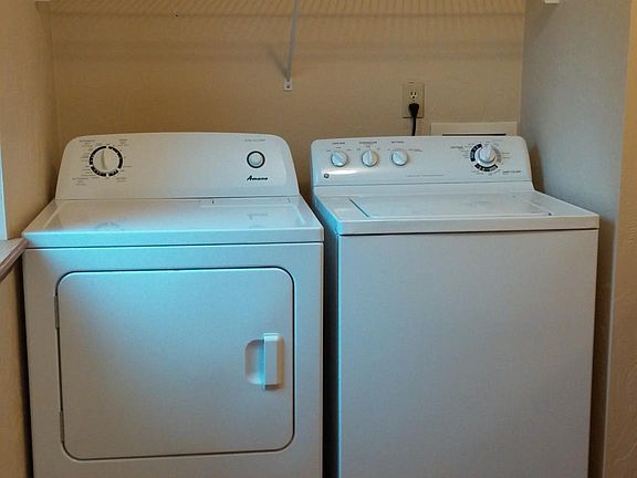 Laundry room with full size washer and dryer!