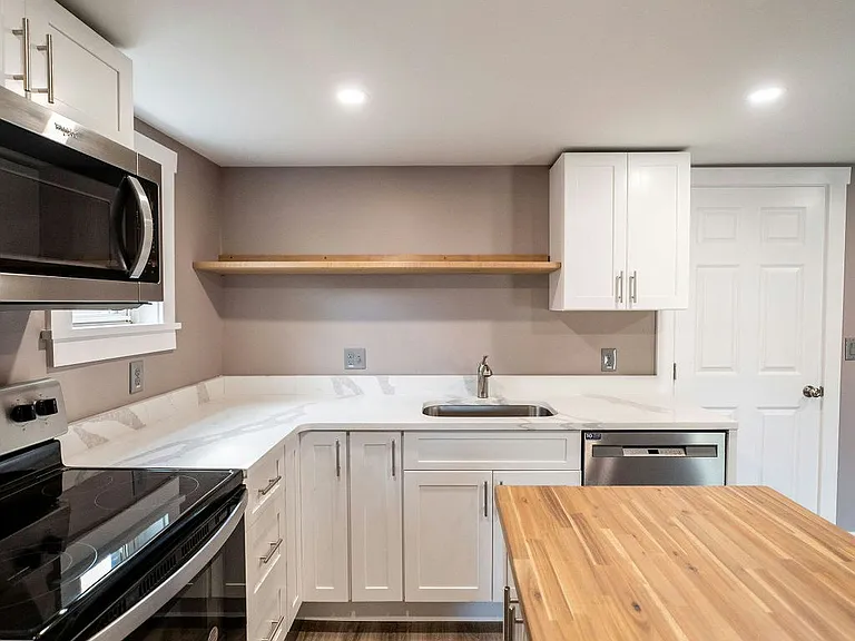 Beautiful newly restored kitchen/shared room, modern appliances and butcher block island!