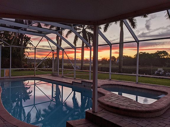 Take in majestic sunrises and sunsets from the screened pool patio. Property is south-facing and catches both magnificently.