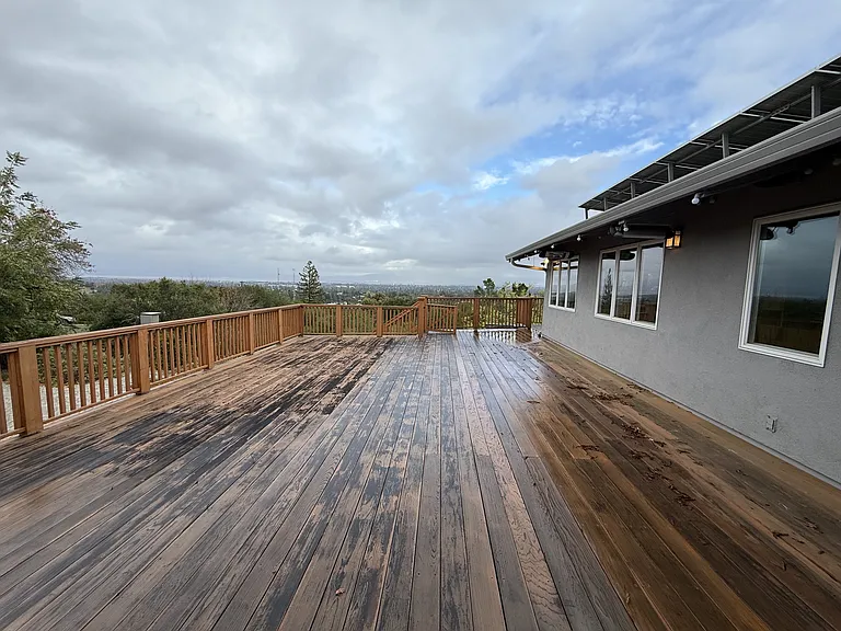 Wonderful rear upper deck beckoning for entertainment or relaxation, offering a spectacular view of the bay.