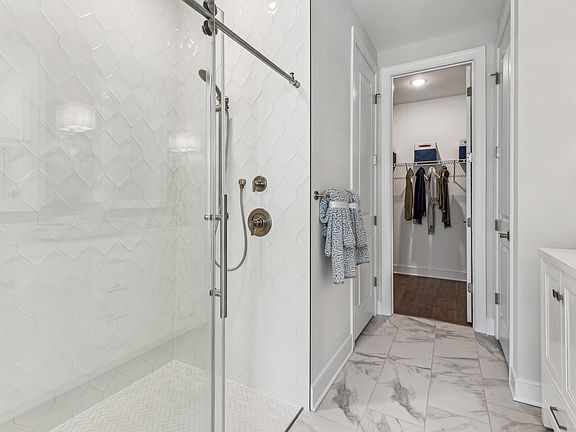 Primary bath with glass-shower enclosure