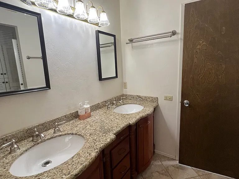 Double granite sinks with door that leads to living area