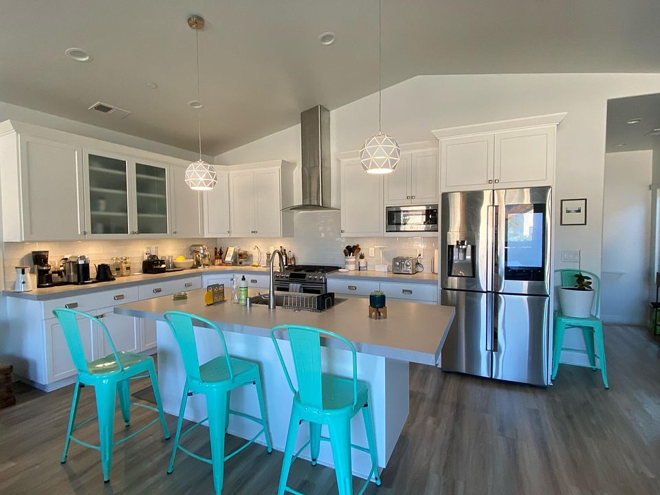 Open kitchen with top end appliances including Samsung refrigerator with family hub