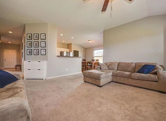 Living Room is open to Kitchen and Dining Areas