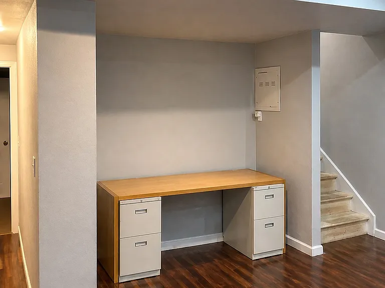 This desk can stay or be removed. We are currently refinishing the stairs.
