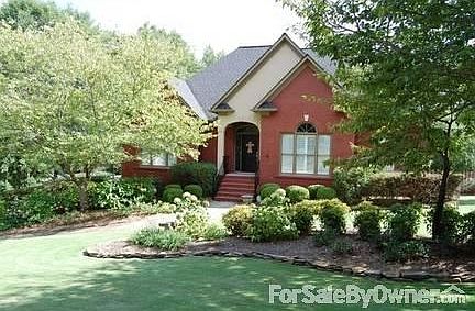 Professionally landscaped with sprinkler system