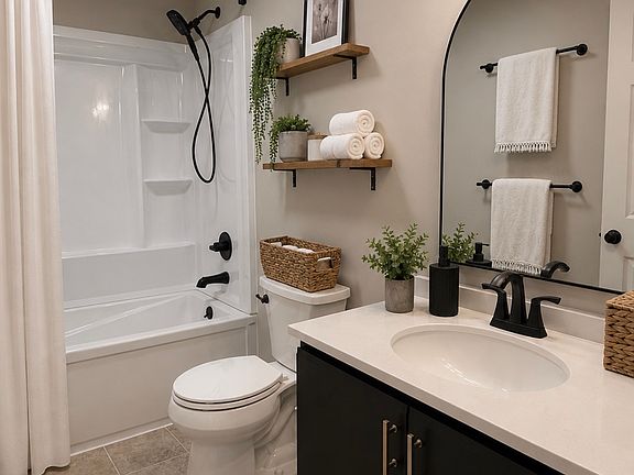 Updated bathroom _ all new shower with soaking tub, sink/vanity, and toilet
