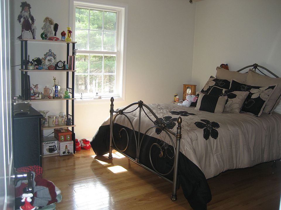BEDROOM WITH HARDWOOD FLOORS AND LARGE CLOSETS
