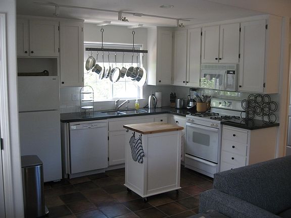 The apartment kitchen. The window overlooks the apartment's private rear yard. The living area is out of view to the right.