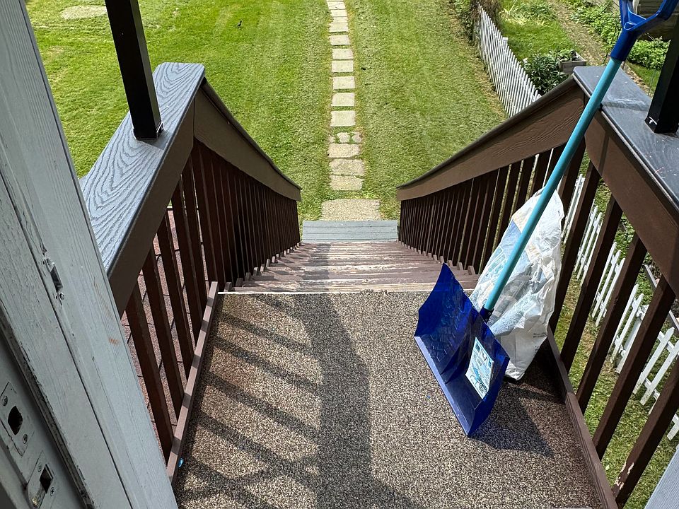 stairs off kitchen to parking in rear alley