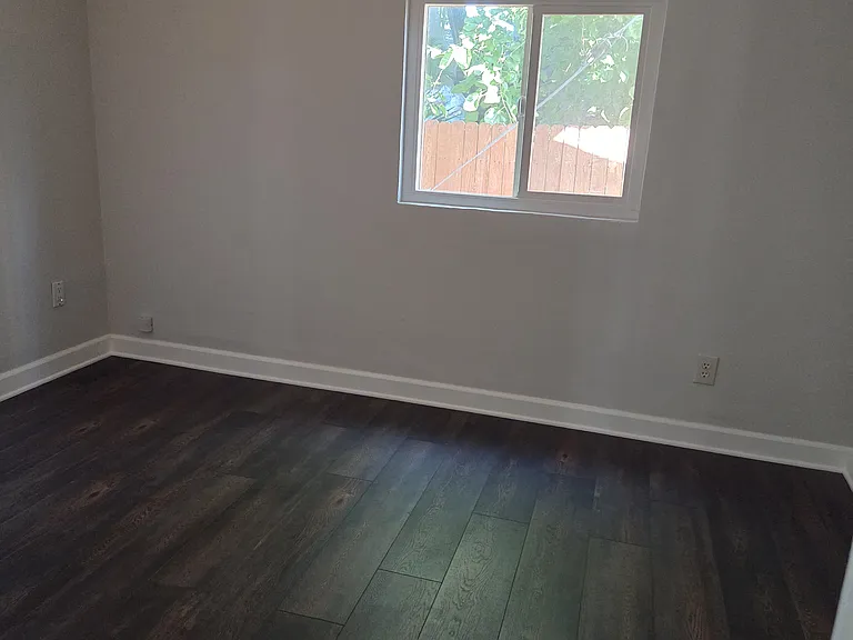 Bedroom has newly installed blinds and small walk in closet. (Blinds not shown)