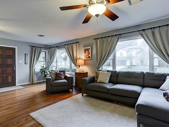 As you enter the home, you are impressed with the open living area with lots of natural light.  Windows are double paned and the flooring is the original hardwood floors.