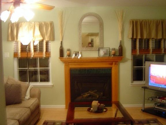Family room has gas fireplace,wood flooring and sliders leading to the rear deck