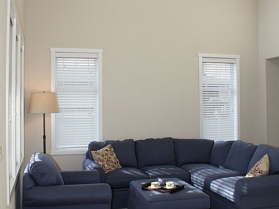 Bright accent windows over formal living room.