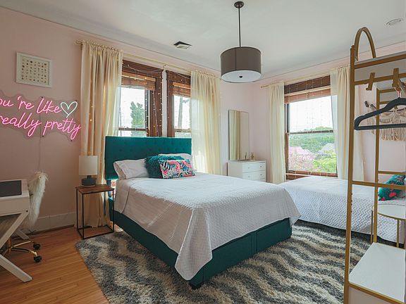 Bedroom 2 has a Queen and a Full with lots of light