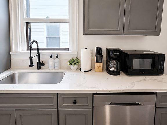Clean, functional kitchen with updated counters and fixtures