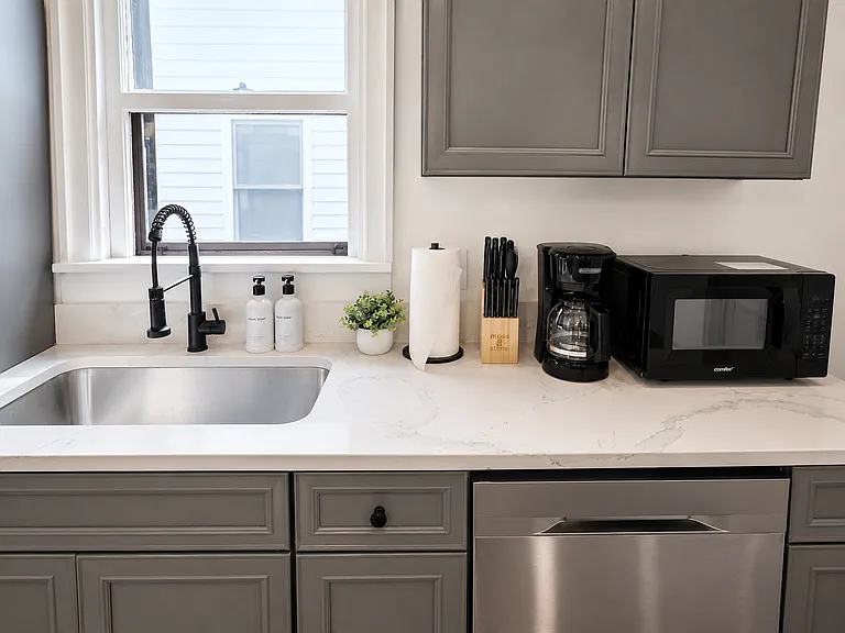 Clean, functional kitchen with updated counters and fixtures