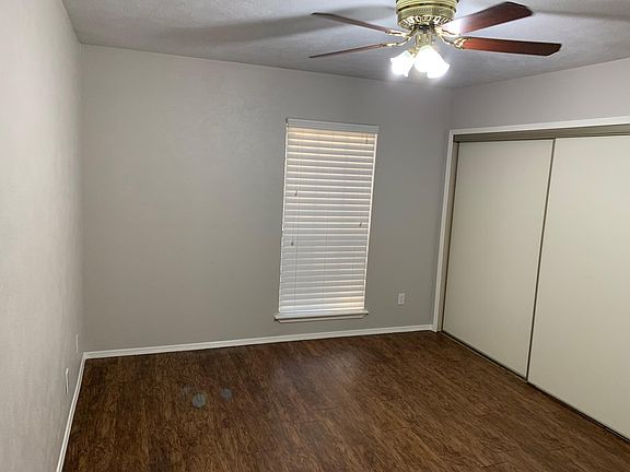 master bedroom with large siding doors for easy access