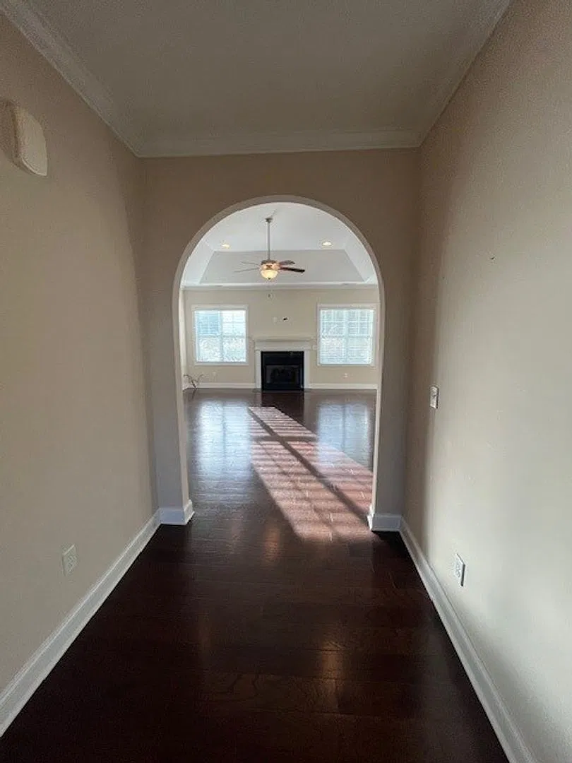 This 4-bedroom, 3-bathroom home in Porters Neck Crossing — Photo 4