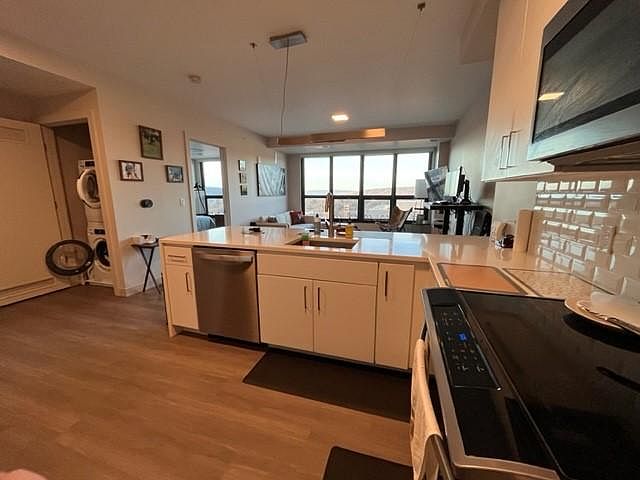 My Apt for sublet. View from Kitchen to Livingroom. You can see the In-Unit Washer/Dryer on left side. **Only Unit for Sublet. Furniture & Furnishings are not included.