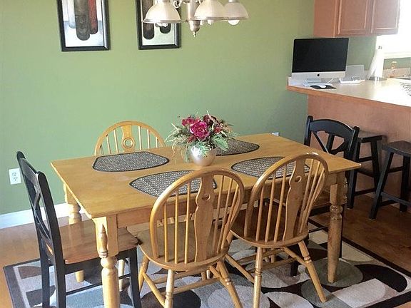 Dining space flows nicely from the living room to the kitchen.