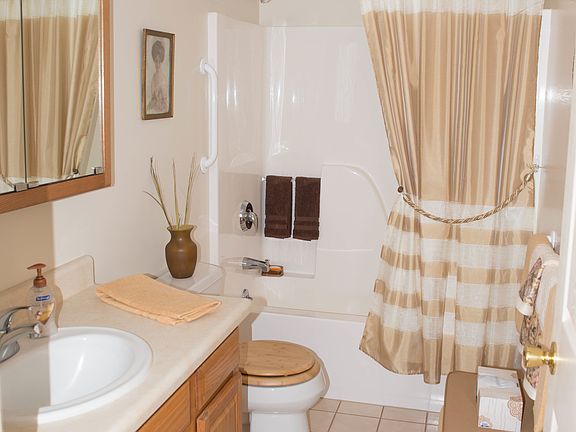 large master bath with comfort level toilets with soft close