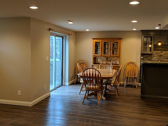 Lower level with walk out to back garden. Wet bar with stone backsplash, 3/4 bath, craft room and two unfinished storage areas.
