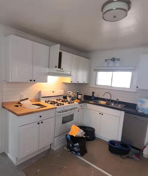 Kitchen. View 1 of 2. Temporary construction materials to be removed.