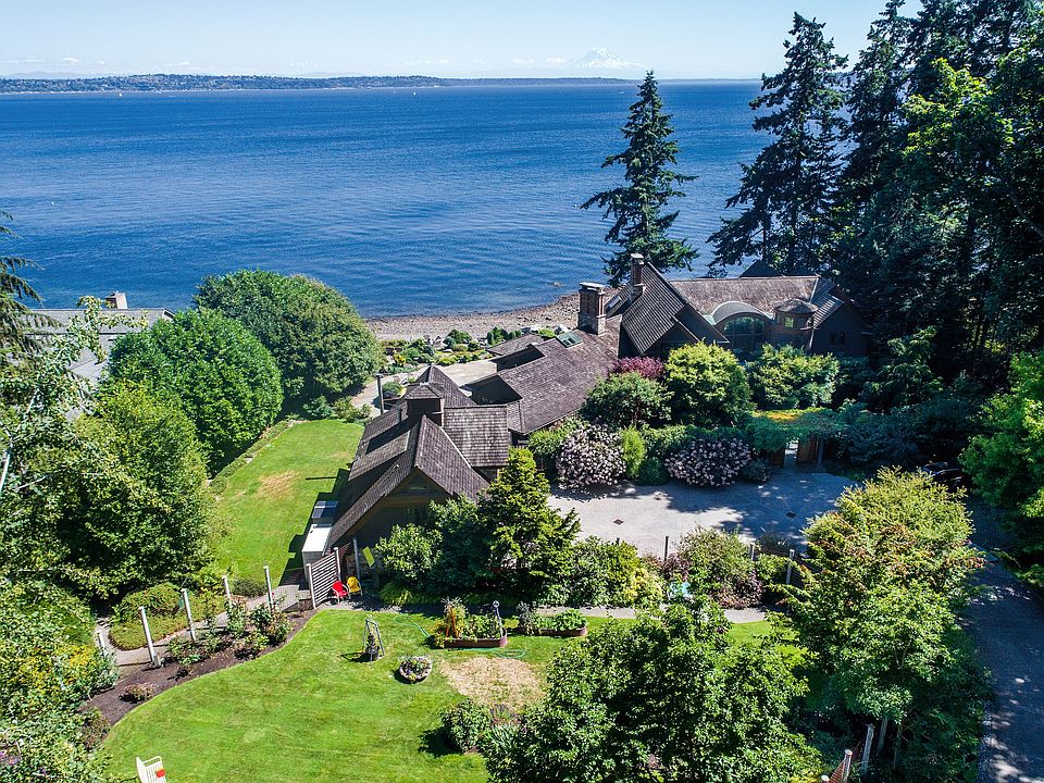 Premium Pre-Treated Shingle Cedar Roof Premium shingle exterior hand-cut stone, thick stamped concrete driveway.