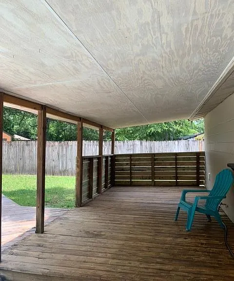 covered deck area on the back of the home -The perfect rain porch :)