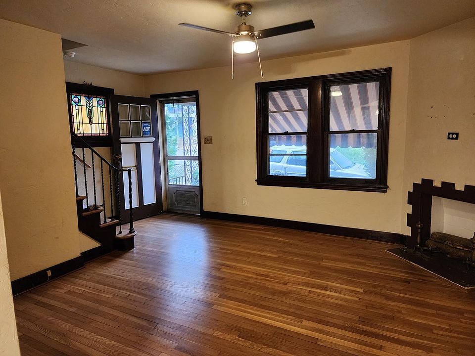 Nice Hardwood floors and stained glass window.