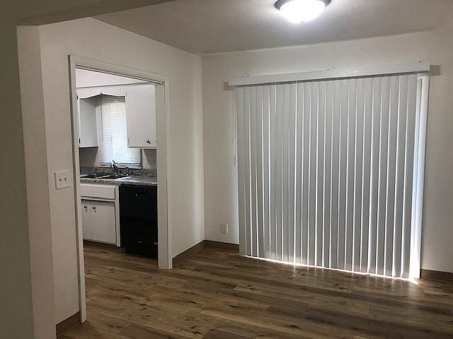 Dining area by kitchen, sliding door to balcony