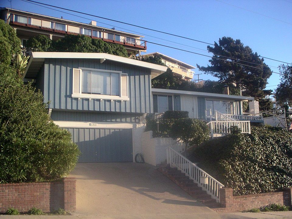 Front of Home Perched High Above Street for Great Ocean Views
