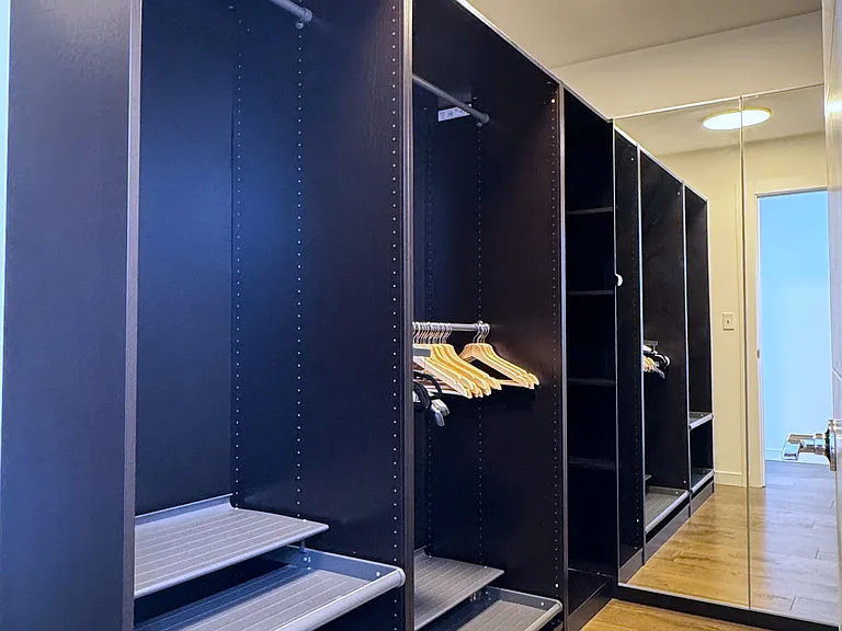 Very spacious walk-in closet with full built-in on-wall closets.