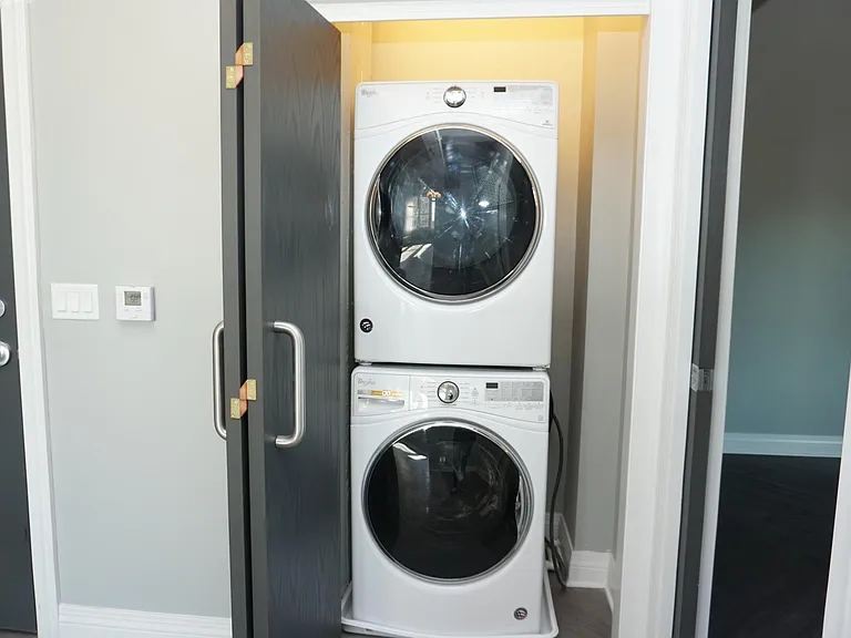Stacked Whirlpool HE washer & gas dryer
