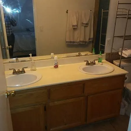 Master bath double sinks, bottom cupboard has a crack on front of door, but works fine .