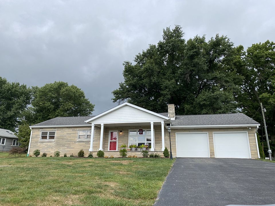 Front of home... 2 car extra long garage with storage, cabinets and washer dryer.