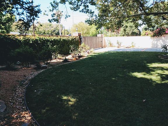 View from front yard to gated entry