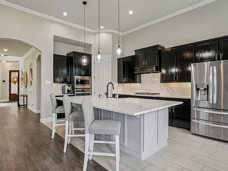 Kitchen. Gas cooktop, blanco farm sink, microwave and oven in wall. Under sink RO system and whole home water filtration and softening included