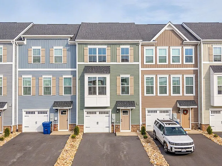 Front of the house; single car garage, driveway fits 2-3 vehicles, dependign on sizes