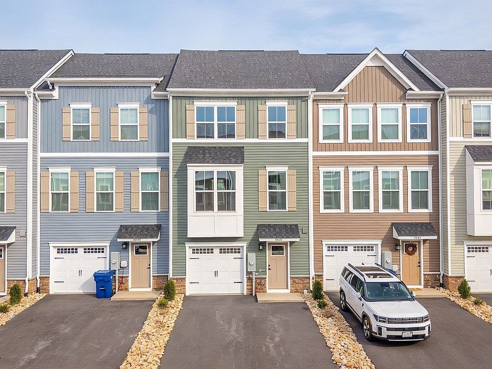 Front of the house; single car garage, driveway fits 2-3 vehicles, dependign on sizes