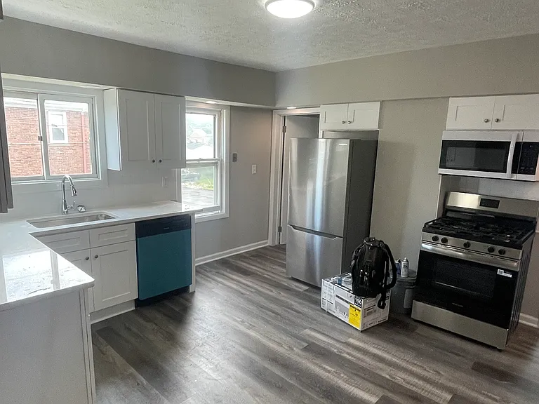 Oversized eat-in kitchen with space for table. New stainless steel appliances
