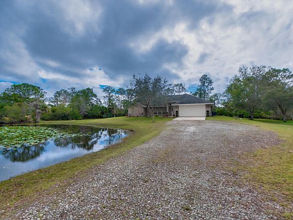 FRONT OF HOME W/ POND