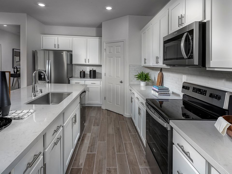 Kitchen in the 4024 floorplan at a Meritage Homes community in Manteca, CA.