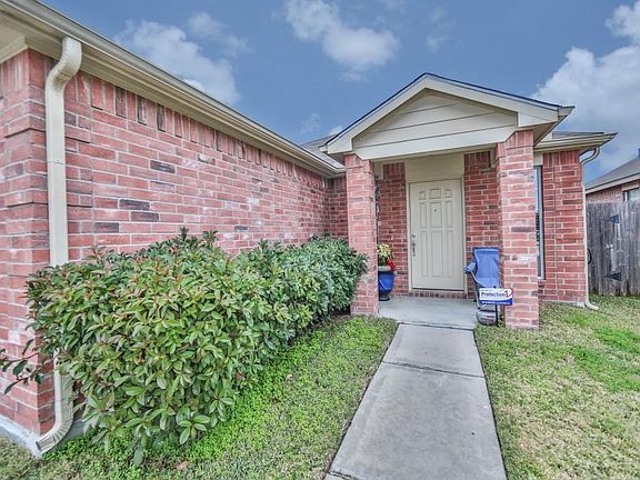 Front of home features a brick covered porch.