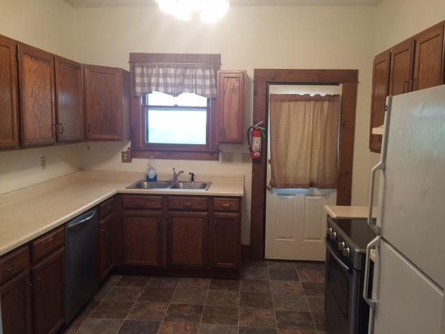 Kitchen with new flooring. Has a dishwasher.