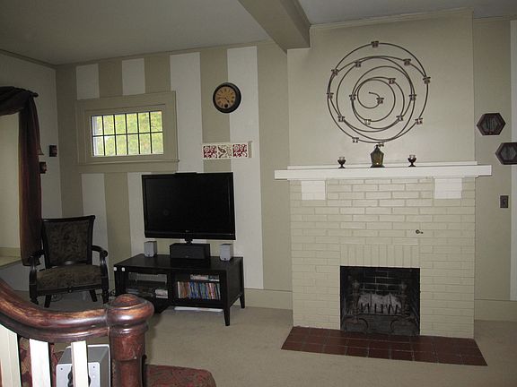 Additional view of living room and fireplace